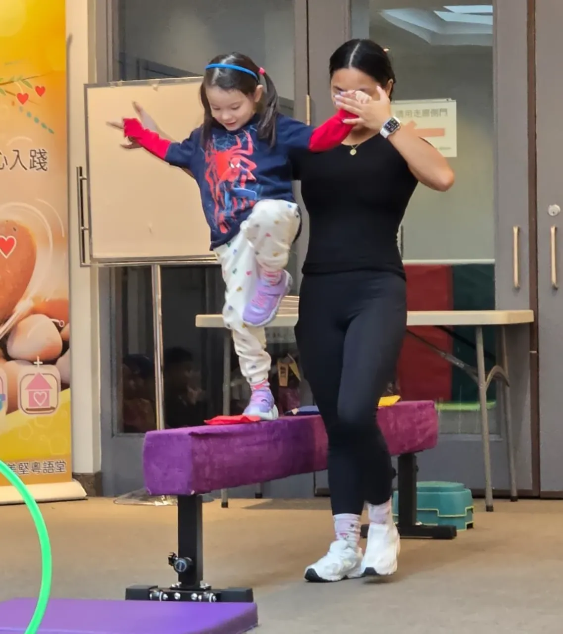Child taking part in an active learning experience with an educator