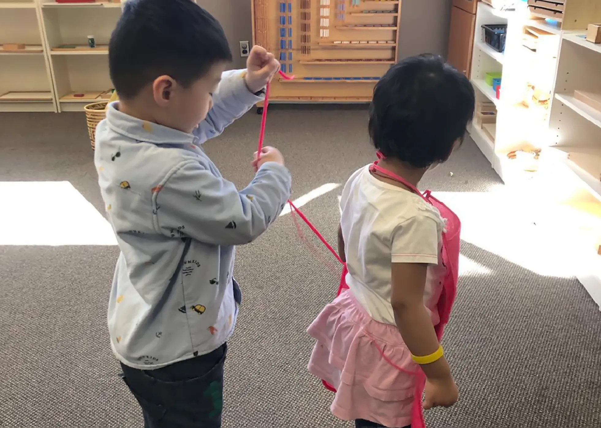 Casa children using Montessori materials
